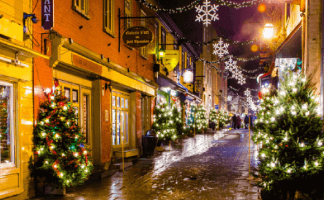Hotel Nouvelle-France Quebec – Old Quebec City winter street with holiday lights and festive atmosphere